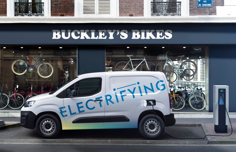Citreon Berlingo electric Vans parked outside shop